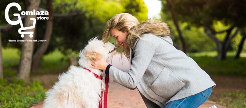 Young girl with her pretty dog which wearing a red remote dog training collar which is Active Lifesyle from Gomlaza store in the outdoor