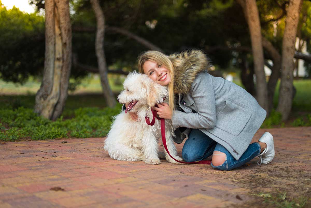 Girl with her dog in the park applying activity by Gomlaza's Active Lifestyle